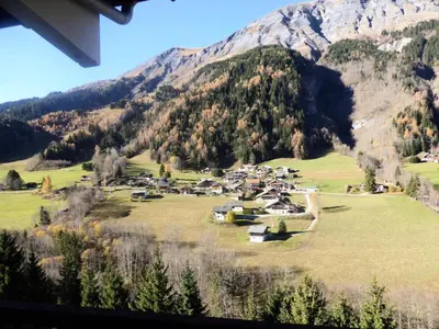 a small village in a field with a mountain at Résidence Bionnassay - Bionnassay B181 MAE-5332 in Les Contamines-Montjoie