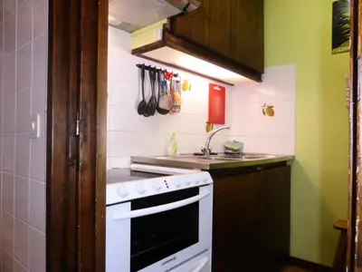 a small kitchen with a stove and a sink at Résidence Bionnassay - Bionnassay B181 MAE-5332 in Les Contamines-Montjoie