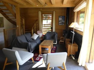 a living room with a couch and a table at Chalet Champelet - Chalet Champelet MAE-5333 in Les Contamines-Montjoie