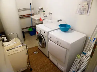 a laundry room with a washing machine and a sink at Chalet Champelet - Chalet Champelet MAE-5333 in Les Contamines-Montjoie