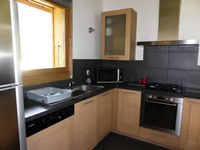 a small kitchen with a sink and a microwave at Chalet Champelet - Chalet Champelet MAE-5333 in Les Contamines-Montjoie