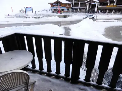 a balcony with a table and snow on the ground at Résidence Schuss - Schuss B230 MAE-5335 in Les Contamines-Montjoie