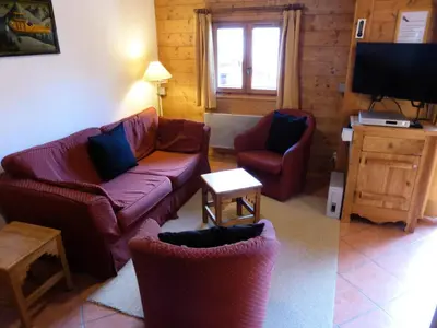 a living room with a couch and two chairs and a television at Résidence Floralie - Domaine Des Lapons 2 - Lapons 2 Floralie 6 MAE-5337 in Les Contamines-Montjoie