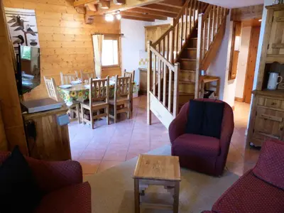 a living room with chairs and a table and stairs at Résidence Floralie - Domaine Des Lapons 2 - Lapons 2 Floralie 6 MAE-5337 in Les Contamines-Montjoie