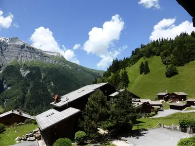 a village in a valley with a mountain at Résidence Floralie - Domaine Des Lapons 2 - Lapons 2 Floralie 6 MAE-5337 in Les Contamines-Montjoie