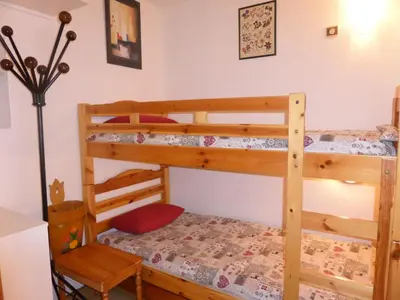 a bedroom with two bunk beds and a lamp at Résidence Pierres Blanches - Pierres Blanches H579 MAE-5342 in Les Contamines-Montjoie