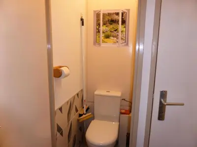 a small bathroom with a toilet and a window at Résidence Pierres Blanches - Pierres Blanches H579 MAE-5342 in Les Contamines-Montjoie