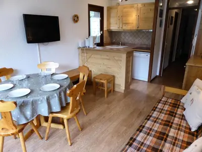 a kitchen and dining room with a table and chairs at Résidence Rochasset - Rochasset D75 MAE-5345 in Les Contamines-Montjoie