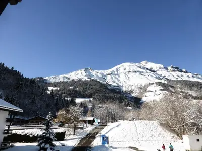 a snow covered mountain in the distance with a ski slope at Résidence Rochasset - Rochasset D75 MAE-5345 in Les Contamines-Montjoie