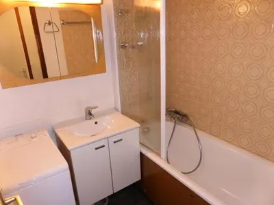 a bathroom with a sink and a shower next to a tub at Résidence Le Brulaz - Brulaz F1E MAE-5347 in Les Contamines-Montjoie