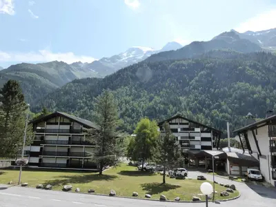 a view of a resort with mountains in the background at Résidence Le Brulaz - Brulaz F1E MAE-5347 in Les Contamines-Montjoie
