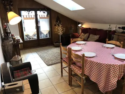 a dining room table with a red and white table cloth at Résidence Les Cimes D'or A - Cimes d'Or A337 MAE-5349 in Les Contamines-Montjoie