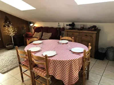 a dining room table with a red and white checkered table cloth at Résidence Les Cimes D'or A - Cimes d'Or A337 MAE-5349 in Les Contamines-Montjoie