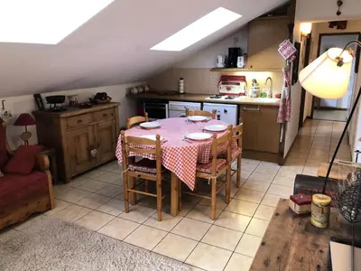 a kitchen with a table and chairs in a room at Résidence Les Cimes D'or A - Cimes d'Or A337 MAE-5349 in Les Contamines-Montjoie