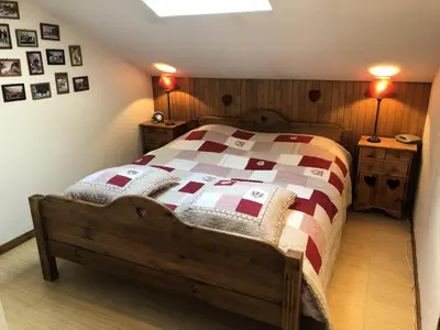 a bedroom with a bed with a quilt on it at Résidence Les Cimes D'or A - Cimes d'Or A337 MAE-5349 in Les Contamines-Montjoie
