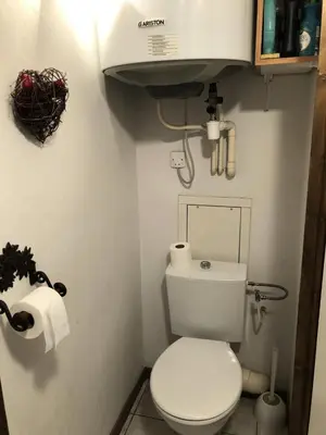 a small bathroom with a white toilet and toilet paper at Résidence Les Cimes D'or A - Cimes d'Or A337 MAE-5349 in Les Contamines-Montjoie