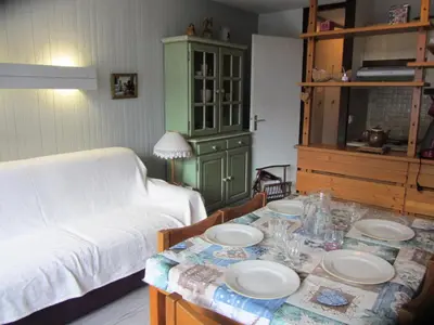 a living room with a table with plates on it at Résidence Le Brulaz - Brulaz F26 MAE-5350 in Les Contamines-Montjoie