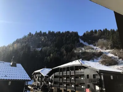 a view of a building with a mountain in the background at Résidence Le Brulaz - Brulaz F26 MAE-5350 in Les Contamines-Montjoie
