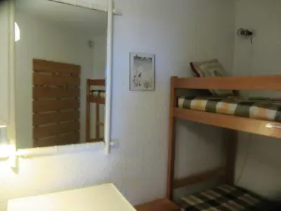 a bedroom with a mirror and a bunk bed at Résidence Le Brulaz - Brulaz F26 MAE-5350 in Les Contamines-Montjoie