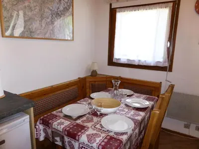 a table with plates and bowls on top of it at Résidence Combettes - Combettes E308 MAE-5352 in Les Contamines-Montjoie