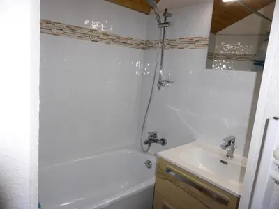 a white bathroom with a tub and a sink at Résidence Combettes - Combettes E308 MAE-5352 in Les Contamines-Montjoie