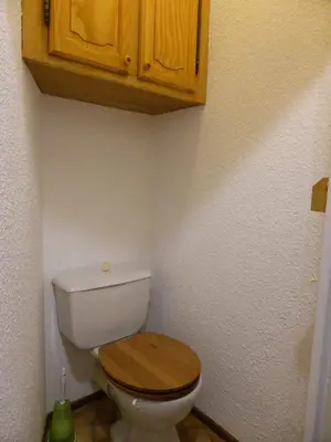 a bathroom with a white toilet with a wooden lid at Résidence Combettes - Combettes E308 MAE-5352 in Les Contamines-Montjoie