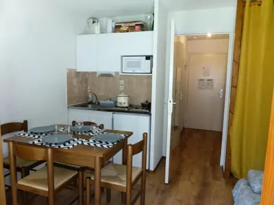 a kitchen and dining room with a table and chairs at Résidence L'enclave - Enclave I638 MAE-5354 in Les Contamines-Montjoie