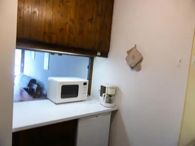 a kitchen with a microwave on a counter at Résidence Bionnassay - Bionnassay B159 MAE-5357 in Les Contamines-Montjoie