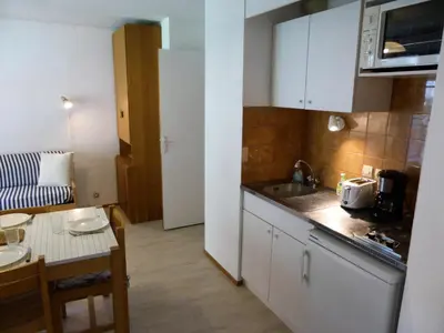 a small kitchen with a sink and a table at Résidence Borgia - Borgia A19 MAE-5359 in Les Contamines-Montjoie