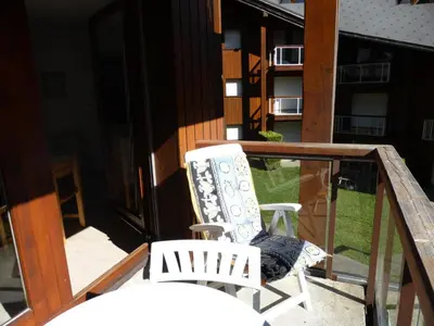 two chairs sitting on the balcony of a house at Résidence Borgia - Borgia A19 MAE-5359 in Les Contamines-Montjoie