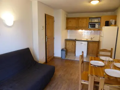 a kitchen and dining room with a table and a couch at Résidence Le Grand Panorama - Grand Panorama 115 MAE-5286 in Saint-Gervais-les-Bains