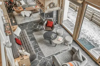an overhead view of a living room with a fireplace at Chalet Nepal in Megève