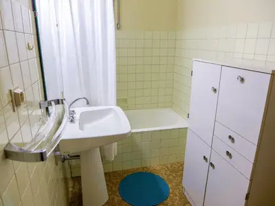 a bathroom with a sink and a bath tub at Studio L'Aiguille du Midi-9 by Interhome in Chamonix-Mont-Blanc