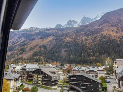 a view of a town with mountains in the background at Studio L'Aiguille du Midi-9 by Interhome in Chamonix-Mont-Blanc