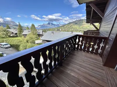 a balcony with a view of the mountains at Appartement 3 pièces+cabine à Megève, près des pistes, terrasse, parking, 6 couchages - FR-1-597-1 in Megève