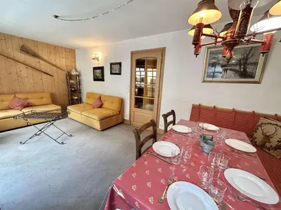 a living room with a table and a couch at Duplex à Megève, 6 Couchages, Proche Centre et Pistes - FR-1-597-4 in Megève