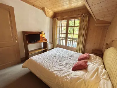 a bedroom with a bed with two pillows on it at Duplex à Megève, 6 Couchages, Proche Centre et Pistes - FR-1-597-4 in Megève