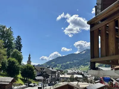 a view of a town with a mountain in the background at Duplex à Megève, 6 Couchages, Proche Centre et Pistes - FR-1-597-4 in Megève