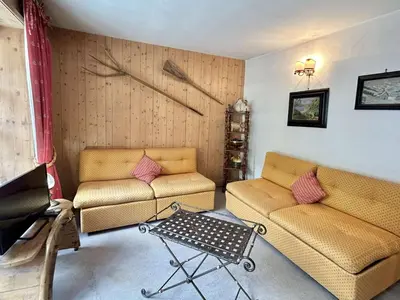 a living room with two couches and a table at Duplex à Megève, 6 Couchages, Proche Centre et Pistes - FR-1-597-4 in Megève