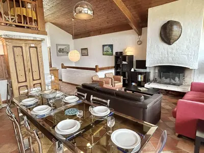 a living room with a table and a couch at Duplex 4 pièces, 8 couchages, jardin, parking, près des pistes - FR-1-597-3 in Megève