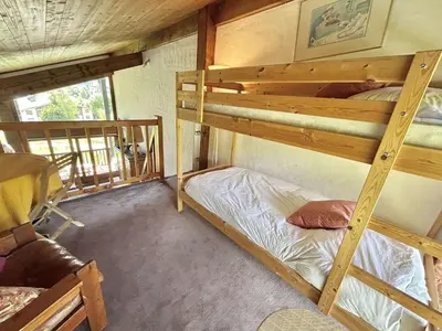 a bedroom with two bunk beds in a house at Duplex 4 pièces, 8 couchages, jardin, parking, près des pistes - FR-1-597-3 in Megève