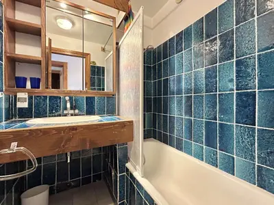 a bathroom with a tub and a sink and a mirror at Duplex 4 pièces, 8 couchages, jardin, parking, près des pistes - FR-1-597-3 in Megève