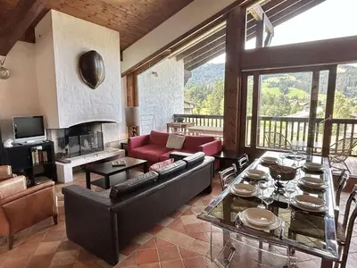 a living room with a couch and a table at Duplex 4 pièces, 8 couchages, jardin, parking, près des pistes - FR-1-597-3 in Megève