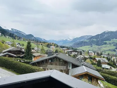 a view of a village with mountains in the background at Appart 2 pièces + mezzanine, 6 couchages, Megève, parking - FR-1-597-7 in Megève