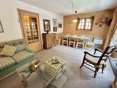 a living room with a couch and a table at Confortable Duplex 3 Pièces, 6 Couchages, Proche Centre et Télécabine, Balcon Sud, Megève - FR-1-597-8 in Megève