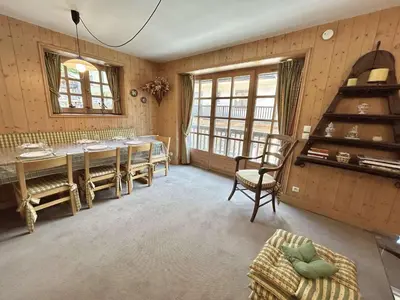 a dining room with a table and chairs at Confortable Duplex 3 Pièces, 6 Couchages, Proche Centre et Télécabine, Balcon Sud, Megève - FR-1-597-8 in Megève