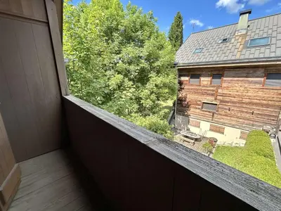a balcony with a view of a house at Confortable Duplex 3 Pièces, 6 Couchages, Proche Centre et Télécabine, Balcon Sud, Megève - FR-1-597-8 in Megève