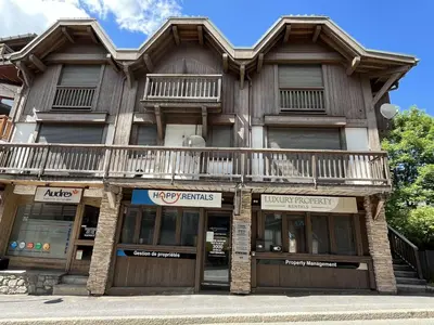a wooden building with a balcony on top of it at Confortable Duplex 3 Pièces, 6 Couchages, Proche Centre et Télécabine, Balcon Sud, Megève - FR-1-597-8 in Megève