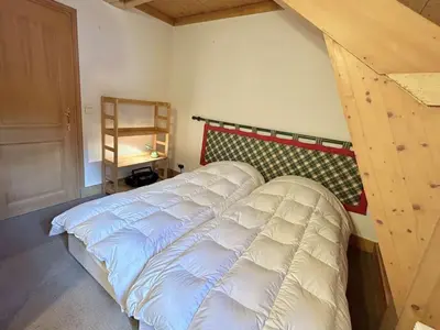 a bedroom with a white bed in a room at Confortable Duplex 3 Pièces, 6 Couchages, Proche Centre et Télécabine, Balcon Sud, Megève - FR-1-597-8 in Megève