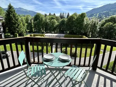a table and chairs on a balcony with a view at Studio avec Piscine Chauffée, Tennis & Balcon - 4 Couchages à Megève - FR-1-597-14 in Megève